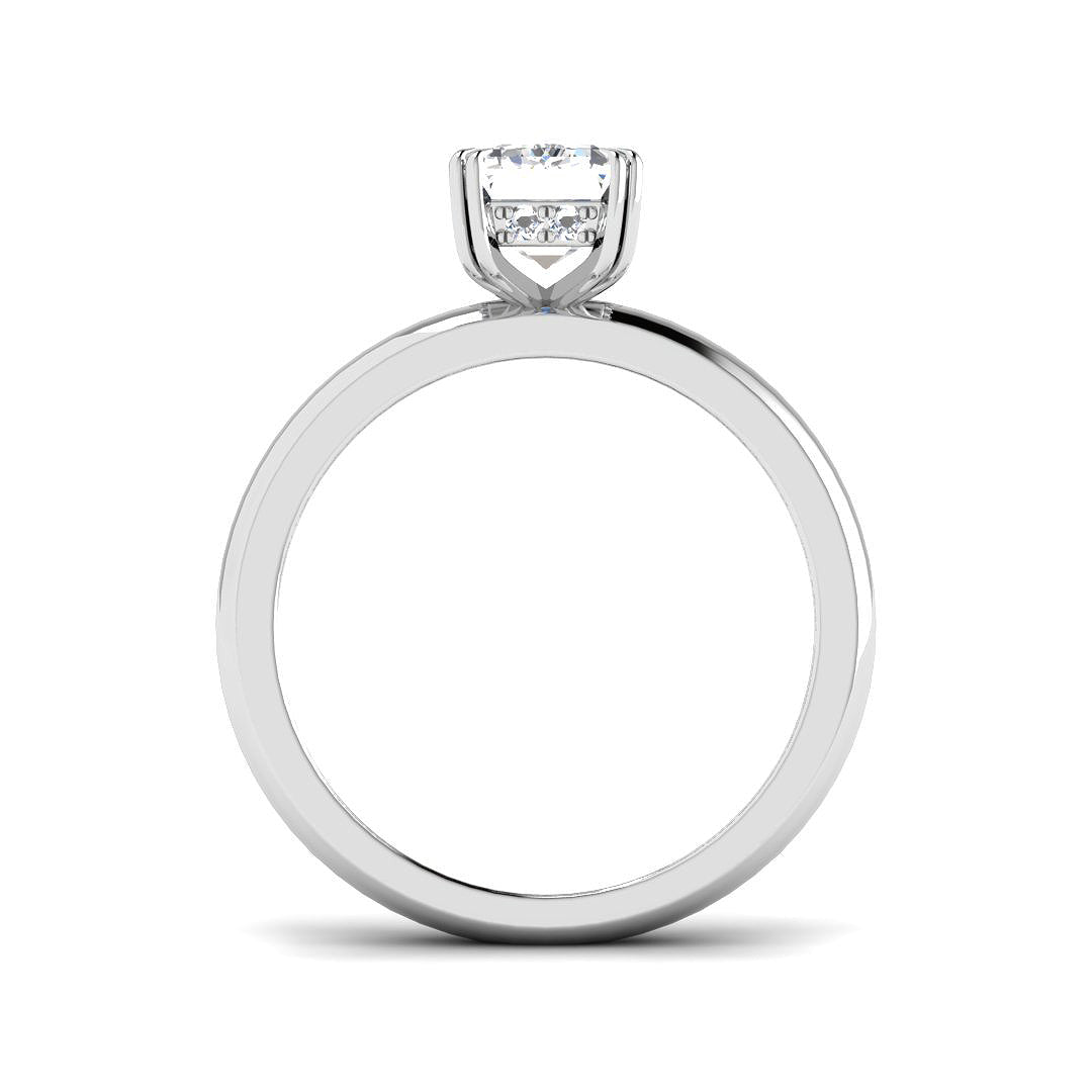 Minimal emerald cut diamond solitaire ring crafted in polished white gold