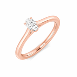 Oval cut diamond solitaire engagement ring in rose gold with a polished band and elegant oval diamond.