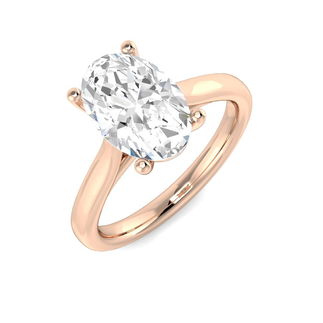Oval cut diamond solitaire engagement ring in rose gold featuring a timeless solitaire design.