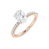 Oval cut diamond solitaire engagement ring in rose gold with pavé setting