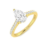 Pear cut diamond engagement ring with pavé band in yellow gold
