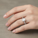 Emerald cut diamond solitaire engagement ring with pavé diamond band