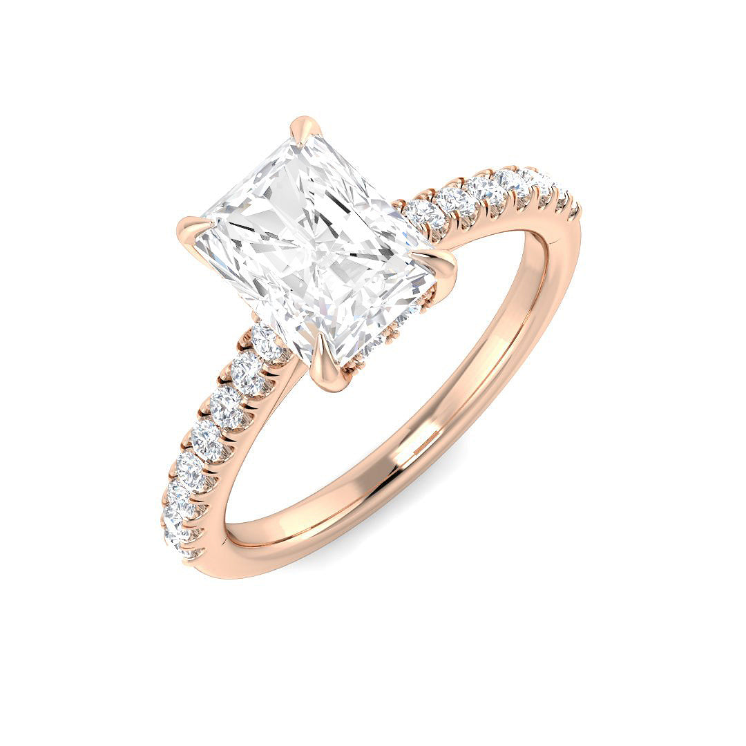 Rose gold ring with a large diamond and smaller diamonds on the band against a white background