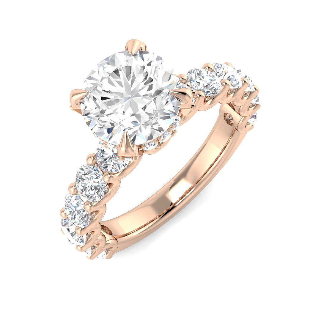 Rose gold ring with a large diamond and smaller diamonds on a white background