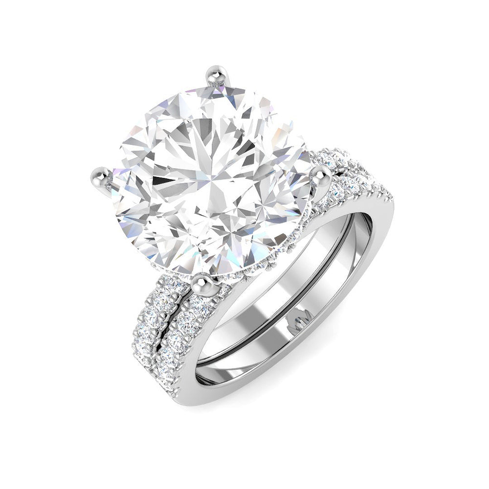 Diamond ring with a large central gemstone and smaller stones on a white background