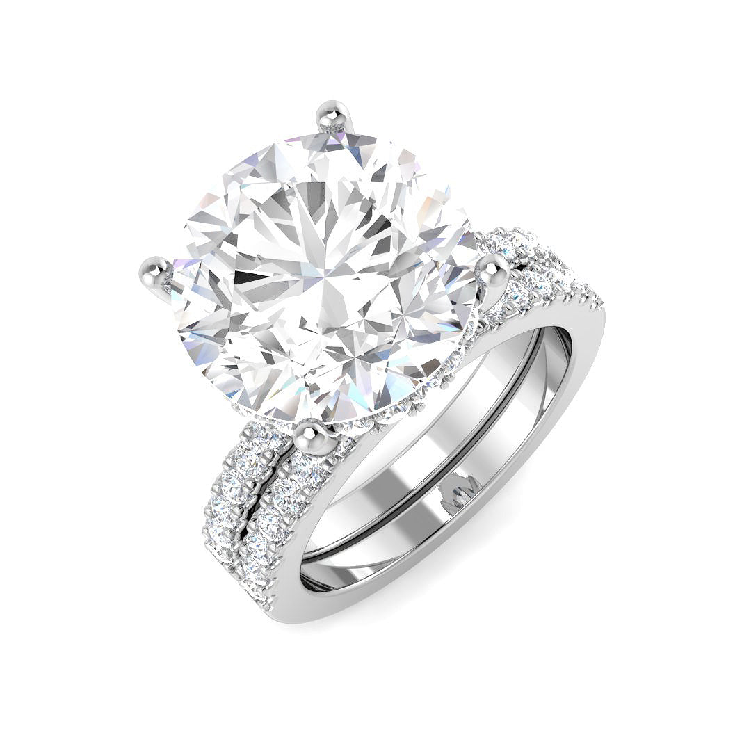 Diamond ring with a large central gemstone and smaller stones on a white background