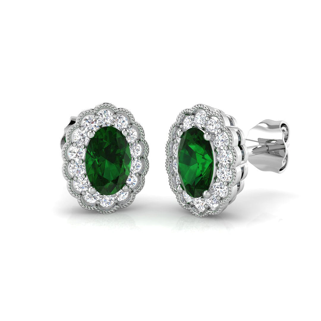 Oval cut emerald halo stud earrings with gemstone cluster setting