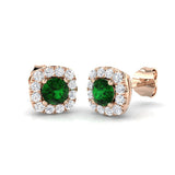 Luxury emerald halo earrings with prong set gemstone and round pave diamonds