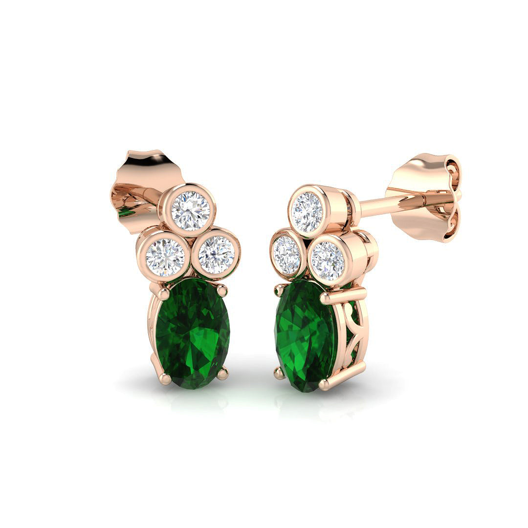Luxury oval emerald stud earrings with push back clasp and bezel diamonds
