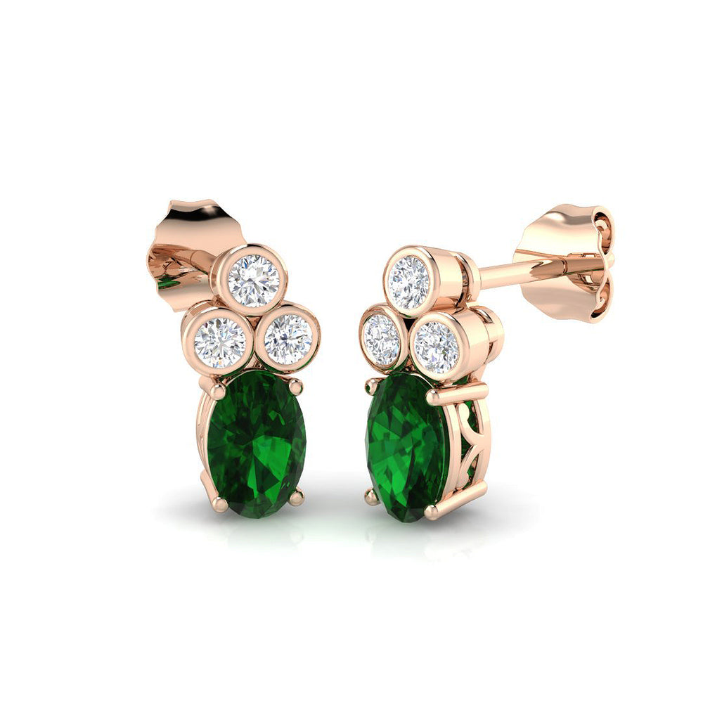 Luxury oval emerald stud earrings with push back clasp and bezel diamonds