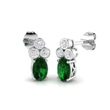 Oval cut emerald diamond earrings with prong set emerald and bezel set diamonds