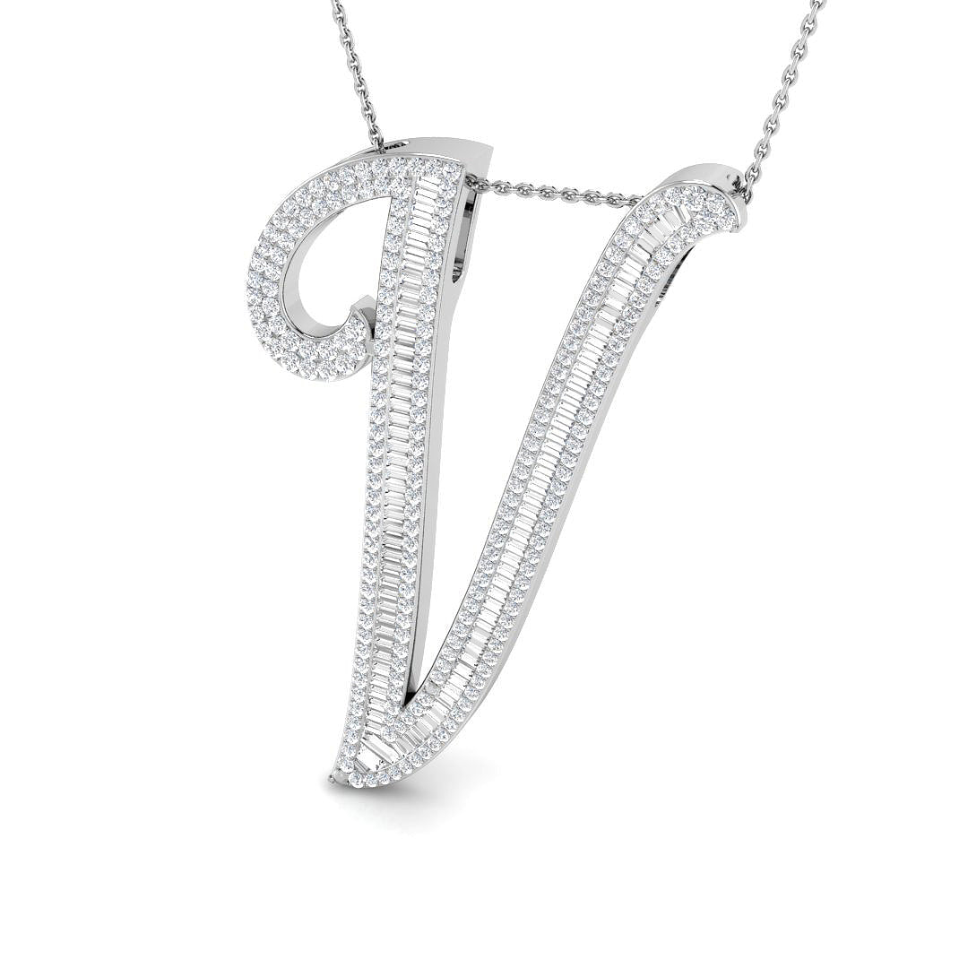 Gold initial pendant with baguette and round cut diamonds.