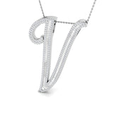Gold initial pendant with baguette and round cut diamonds.
