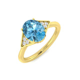 Yellow Gold Oval Blue Topaz Ring with Diamond Side Stones