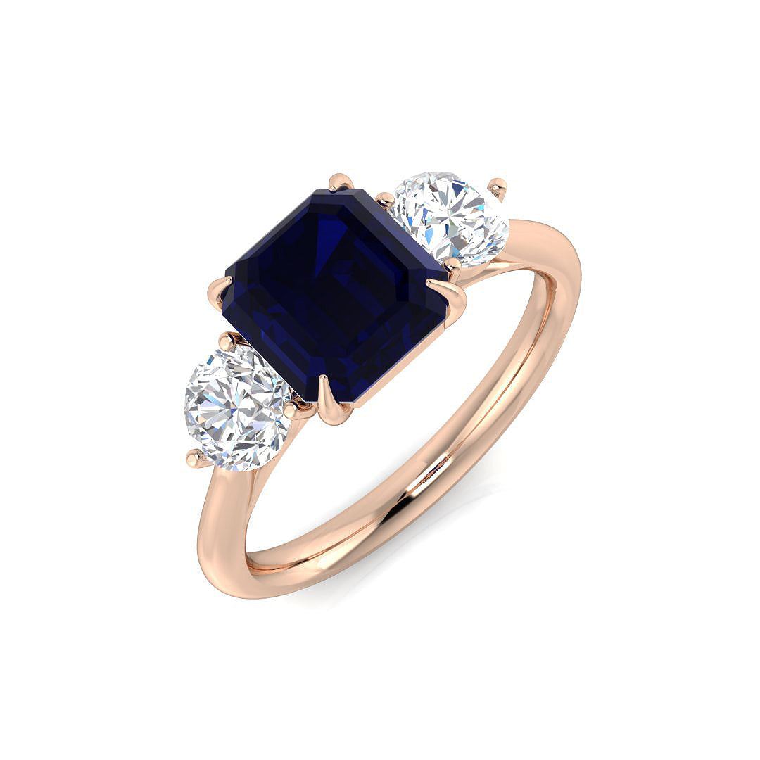 Emerald Cut Blue Sapphire Three Stone Ring in Gold