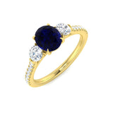 Blue Sapphire Three Stone Ring with Round Diamond Side Stones & Pave Band