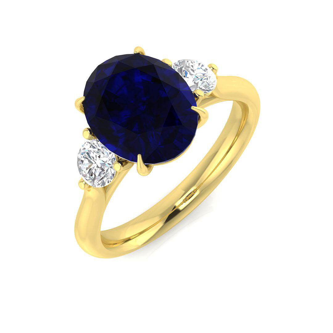 Oval Cut Blue Sapphire Side Stone Ring in Gold