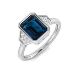 Emerald Cut London Blue Topaz Ring with Round Diamond Side Accents in White Gold