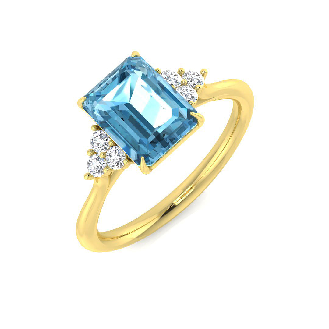 Sky Blue Topaz Emerald Cut Solitaire Ring in Yellow Gold