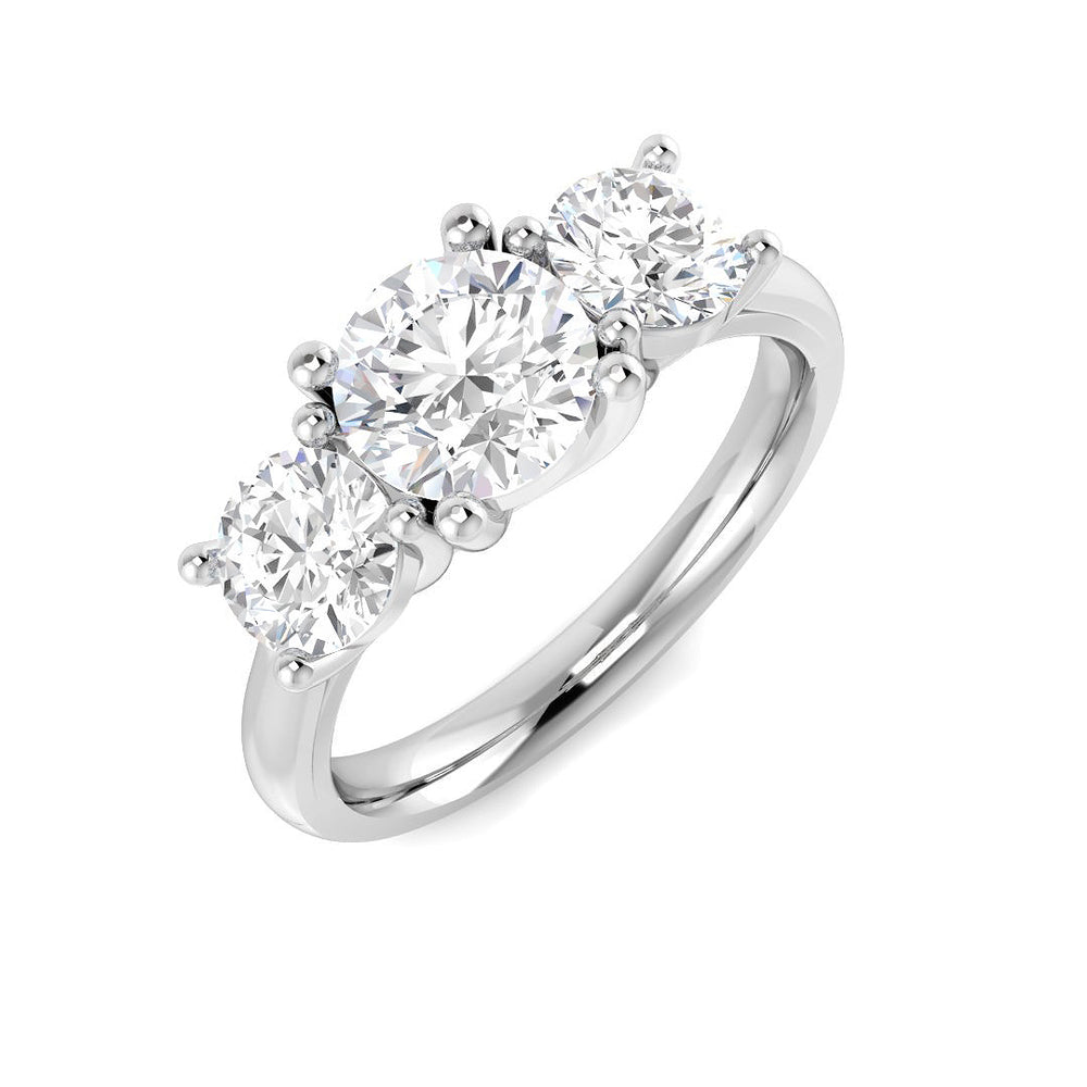 Diamond ring with three clear gemstones on a white background