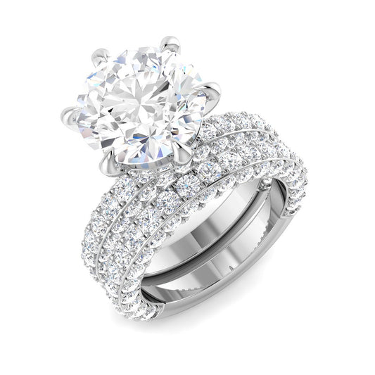 Round diamond engagement ring with triple row pavé band in white gold