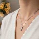 Platinum necklace with a pendant on a blurred background