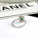 1.50 Carat Emerald and Natural Diamond Cluster Ring
