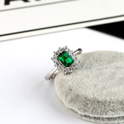 1.50 Carat Emerald and Natural Diamond Cluster Ring