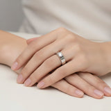 Contemporary white gold solitaire ring with round diamond bar setting