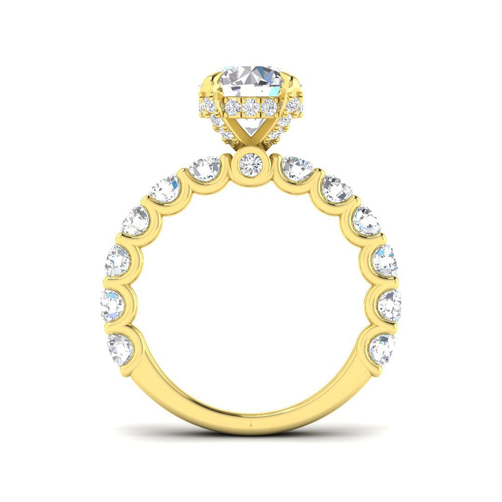Gold ring with a large central diamond and smaller diamonds around on a white background