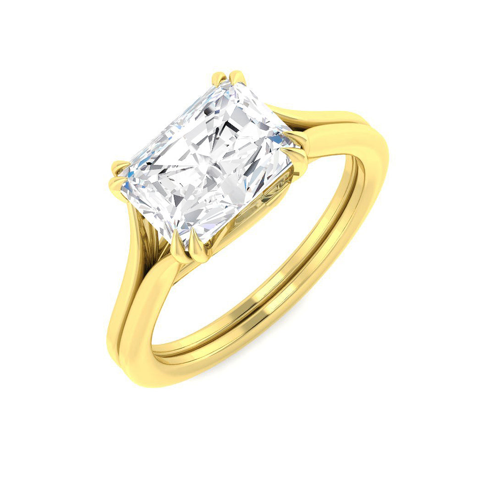 Gold ring with a large rectangular diamond on a white background