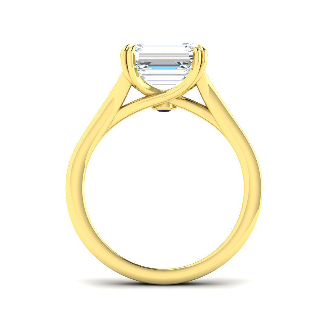 Gold ring with a diamond on a white background