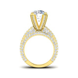 Yellow gold diamond ring with triple pavé band and halo setting