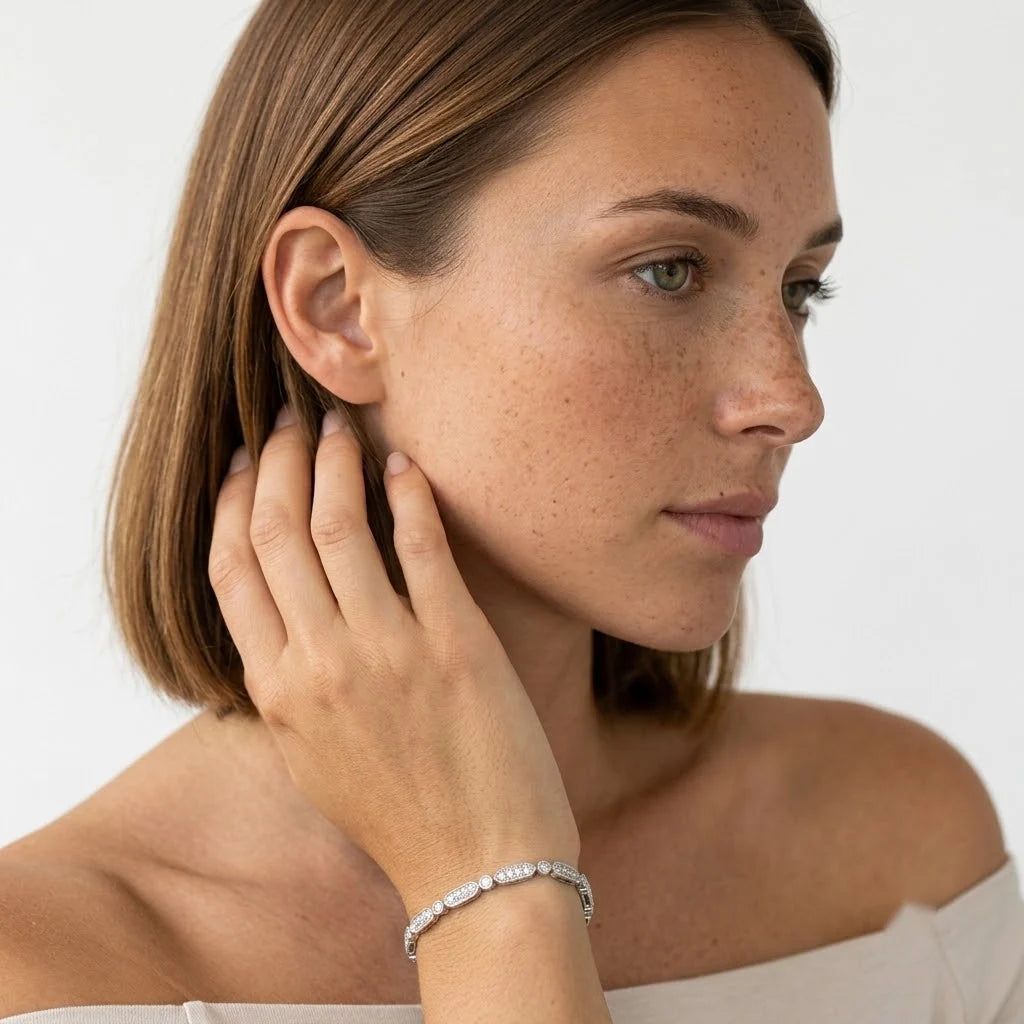 FineDiam white metal diamond bracelet featuring alternating elongated oval and round pavé set links.