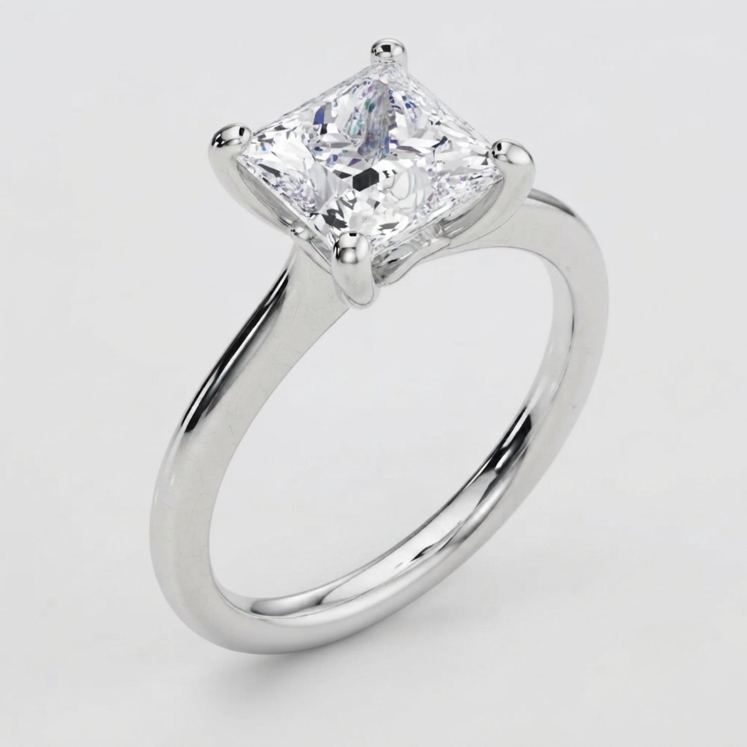 High-resolution macro shot of a D color VVS clarity princess solitaire diamond ring.