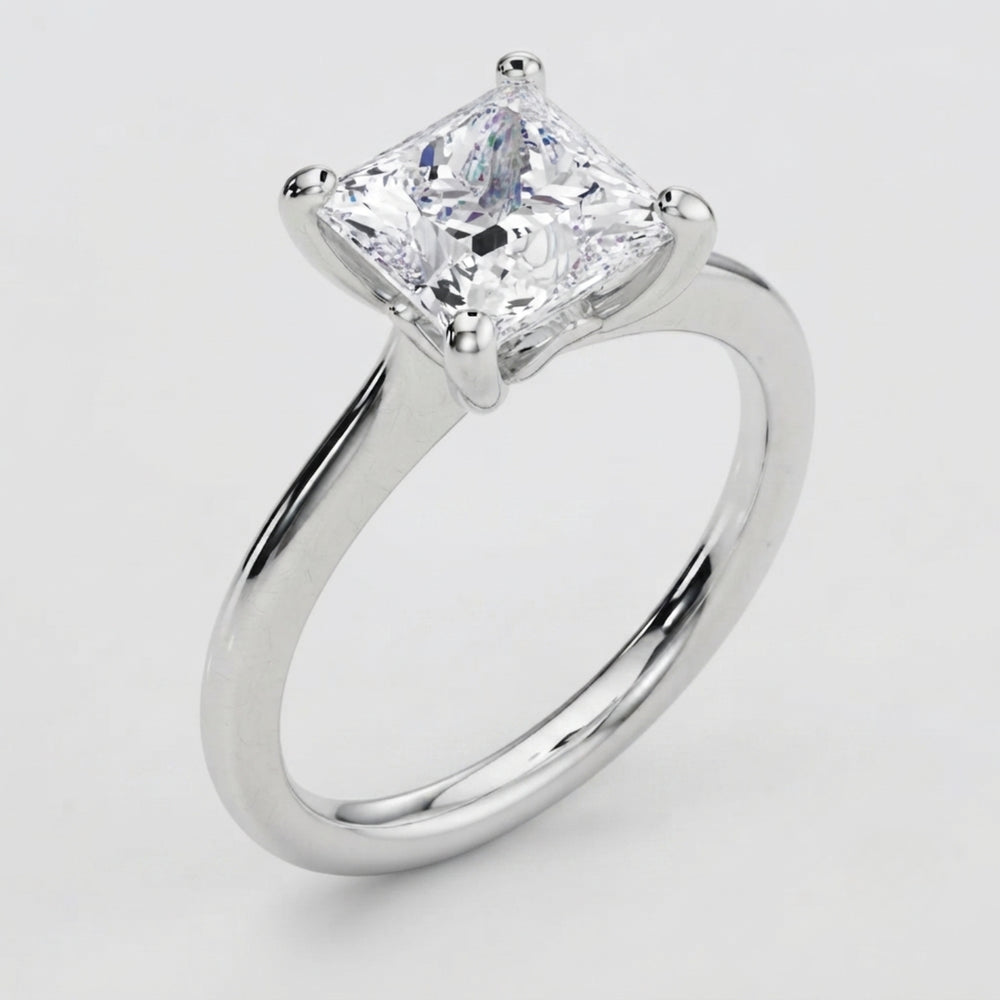 High-resolution macro shot of a D color VVS clarity princess solitaire diamond ring.