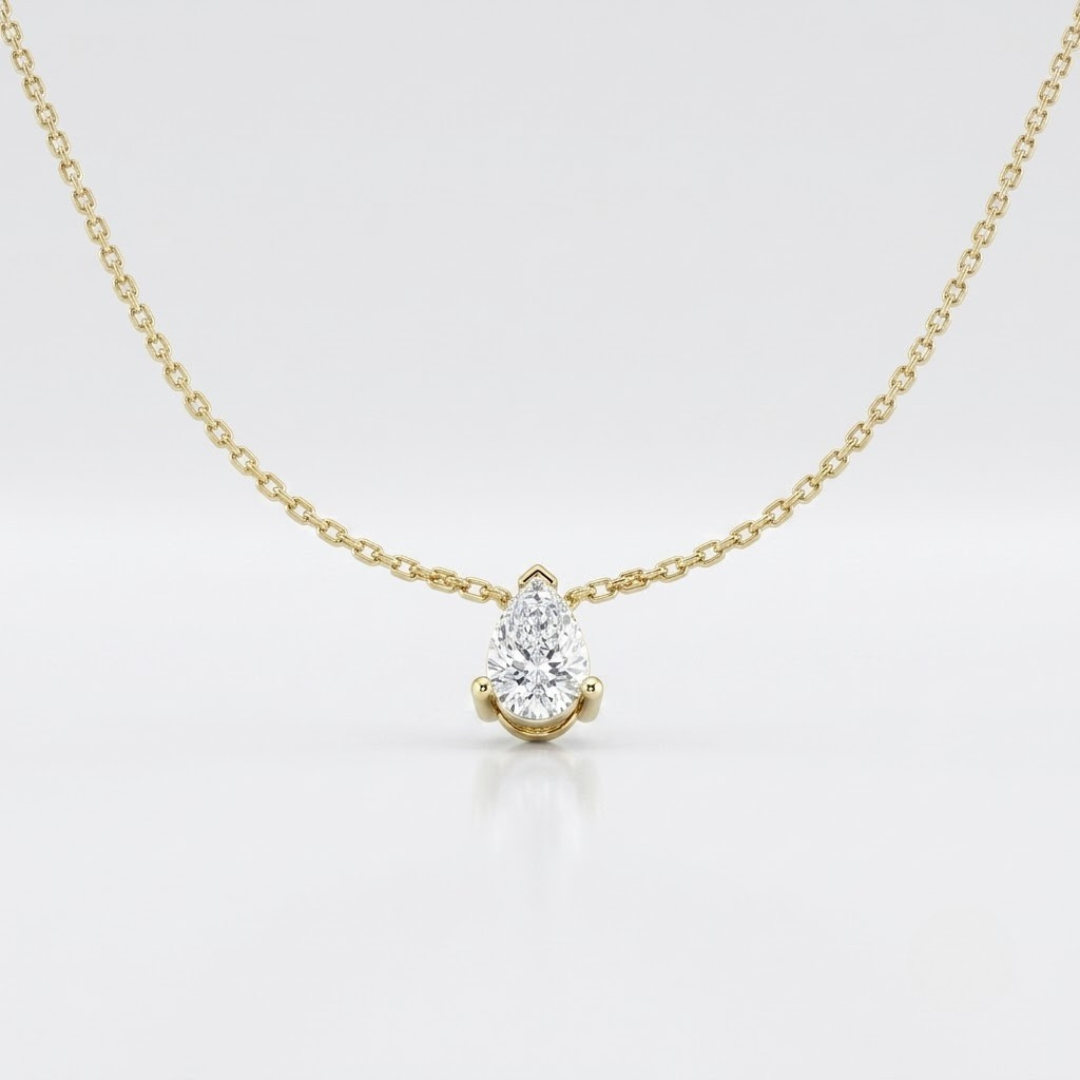 Pear solitaire diamond necklace, a timeless gold birthday present.