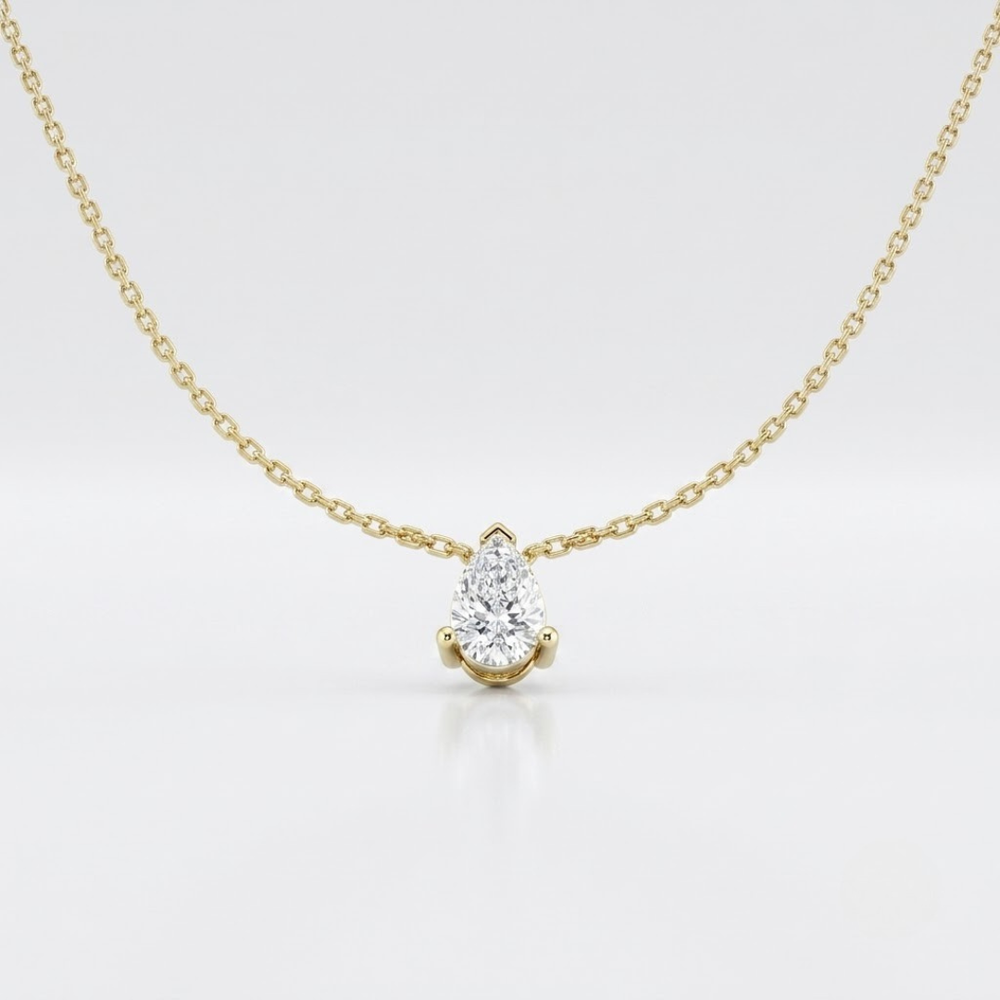 Pear solitaire diamond necklace, a timeless gold birthday present.