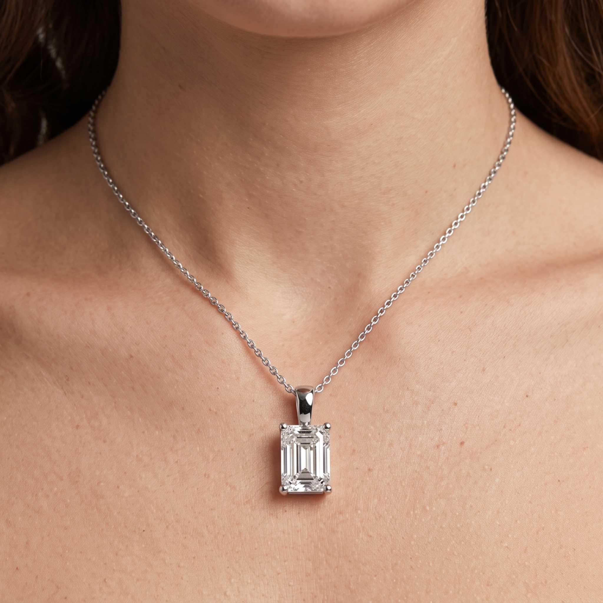 Emerald cut diamond pendant on model birthday gift