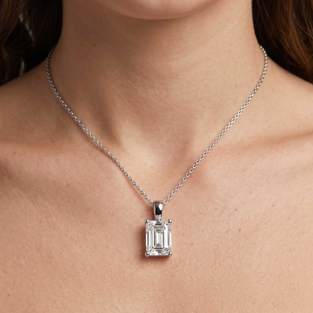 Emerald cut diamond pendant on model birthday gift