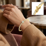 Bracelet de tennis de luxe en or et platine, serti de diamants ronds.
