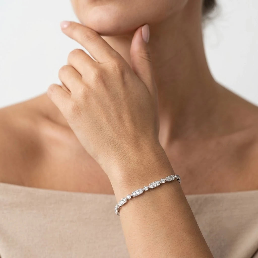 FineDiam diamond bracelet with alternating pavé oval links and round diamond accents in polished white metal.