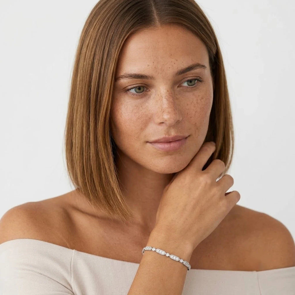 FineDiam white metal diamond bracelet featuring alternating elongated oval and round pavé set links.