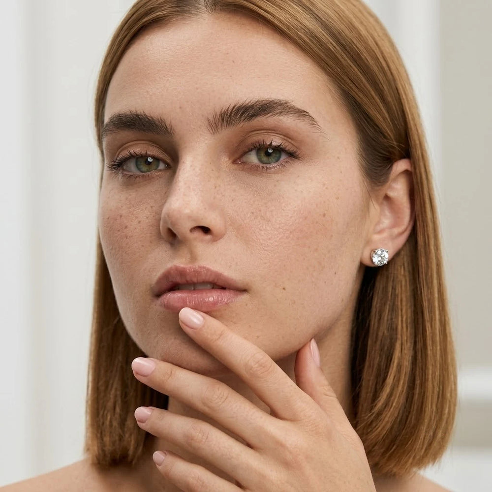 FineDiam diamond cluster stud earrings with round stones arranged in a compact circular design.