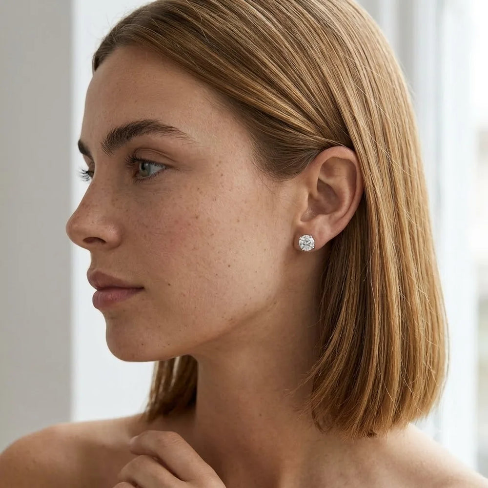 FineDiam round diamond cluster stud earrings featuring a sparkling circular setting in polished white metal.