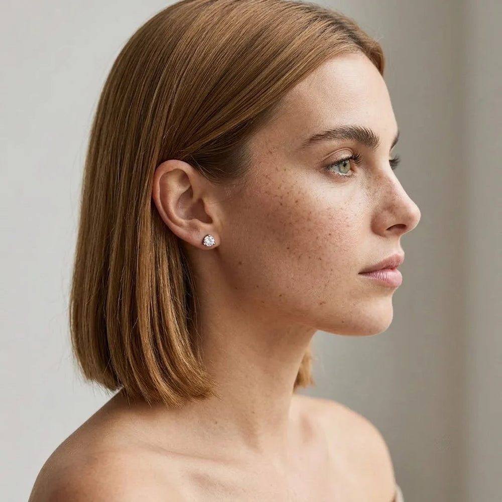 FineDiam round diamond cluster stud earrings featuring a sparkling circular setting in polished white metal.