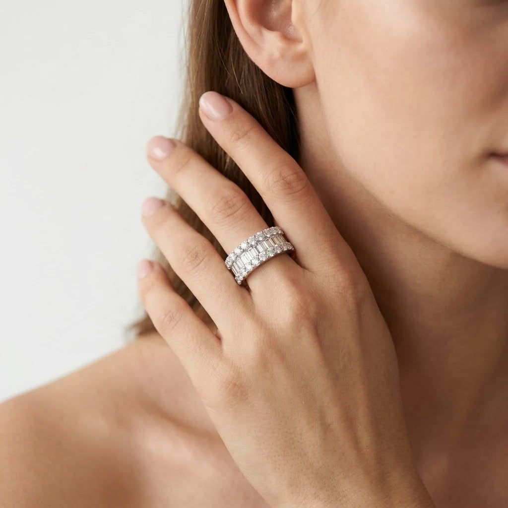  FineDiam white metal multirow diamond ring with baguette cut centre stones and round diamond borders.