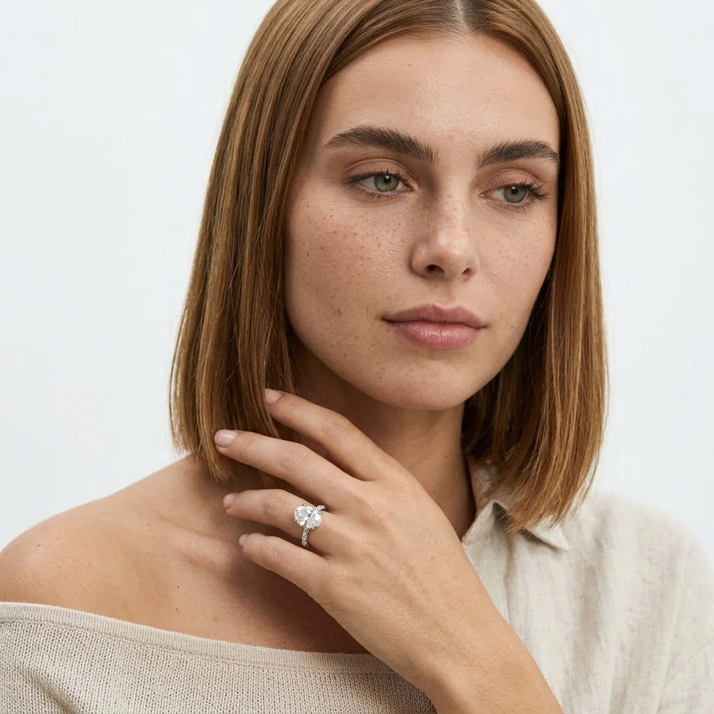 FineDiam floral diamond cluster ring with a sparkling four petal design and diamond accented shoulders.