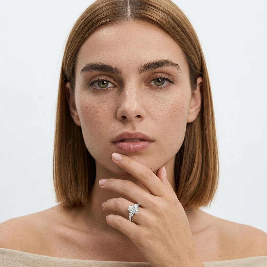 FineDiam floral diamond cluster ring with a sparkling flower-shaped centre and pavé set band.