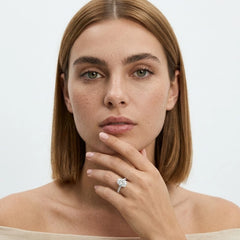 FineDiam floral diamond ring featuring four rounded diamond clusters and a slim white metal band.